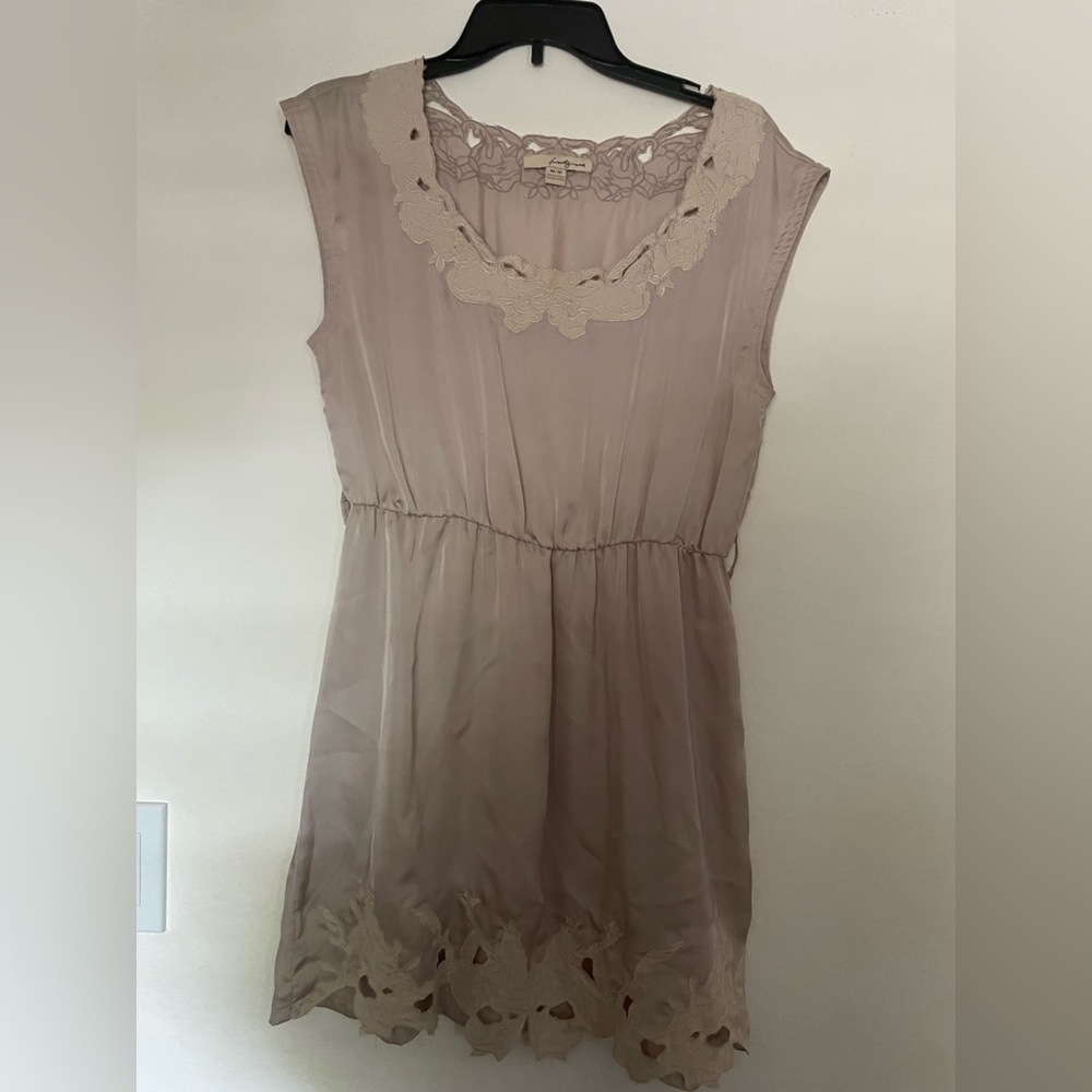 Very pretty beige dress.